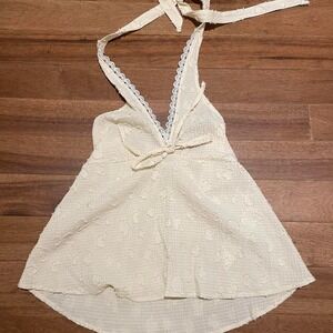 Rusty white halter top with lace trim and bow detail, size M